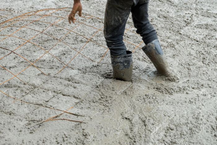 Worker Pouring Concrete